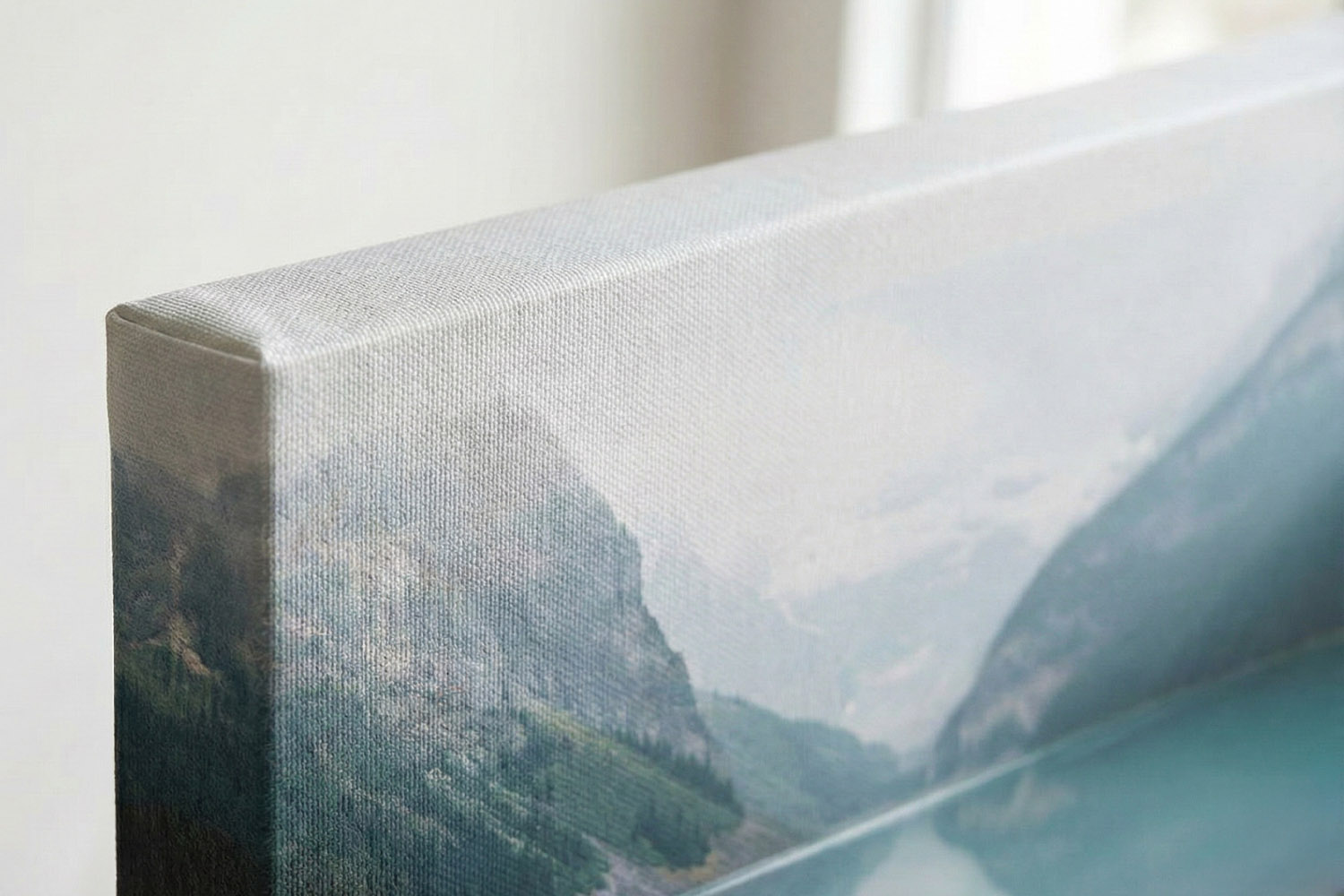 Canvas prints featuring a close-up of a wrapped edge with a mountain landscape design and subtle textured surface detail.