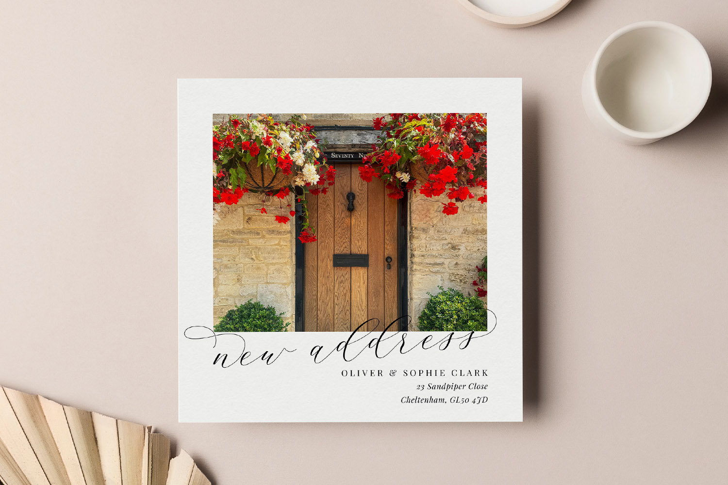 Change of Address Cards featuring a rustic wooden front door with red flowers and elegant script text on a white card