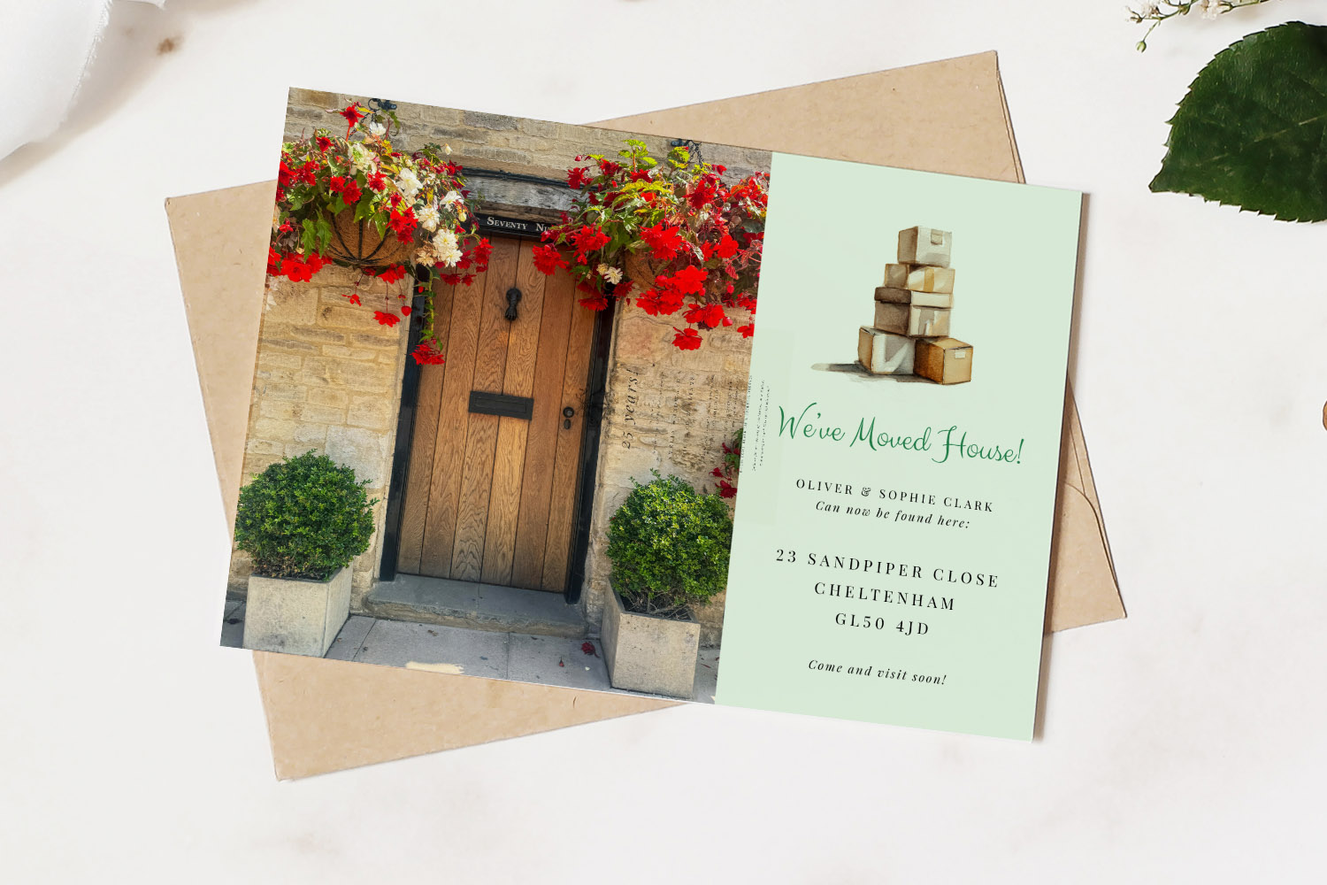 Change of Address Cards featuring a rustic front door with flowers and a printed card showing a new address and moving