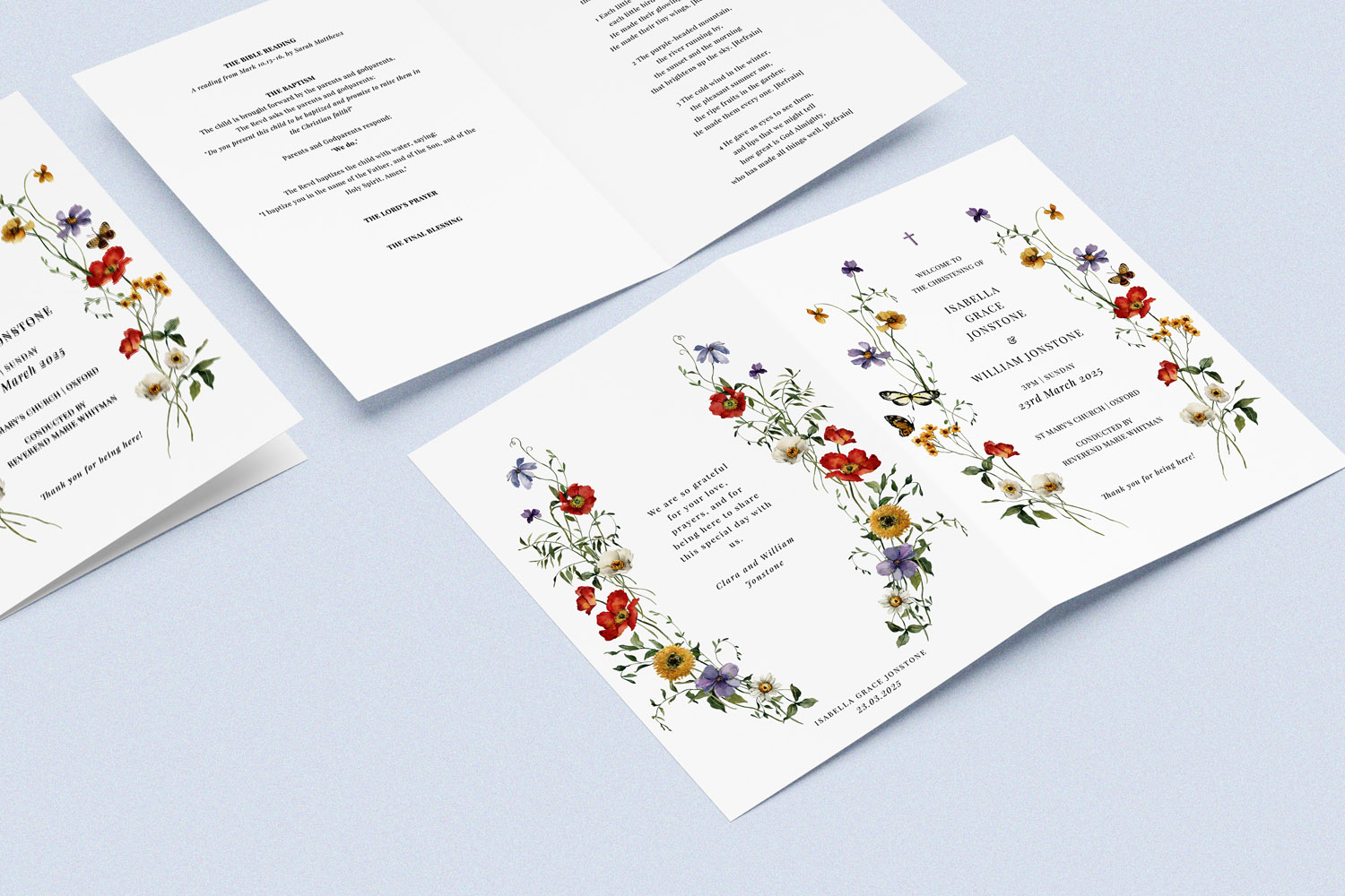 Christening Order of Service with elegant floral border design, folded and laid open on a light blue background, showing