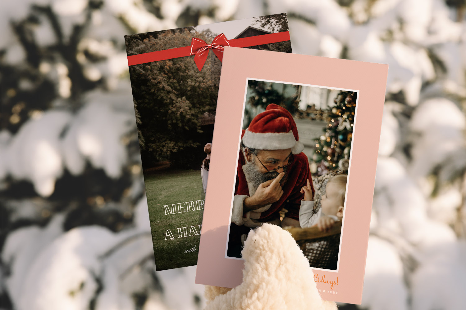Christmas cards featuring personalised photo designs, one with a festive ribbon and another with a Santa scene, held