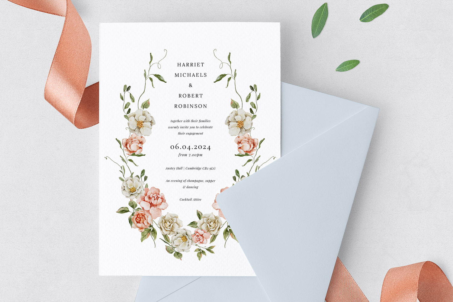 Engagement party invitations with elegant floral design, featuring pastel flowers and greenery on textured white card with