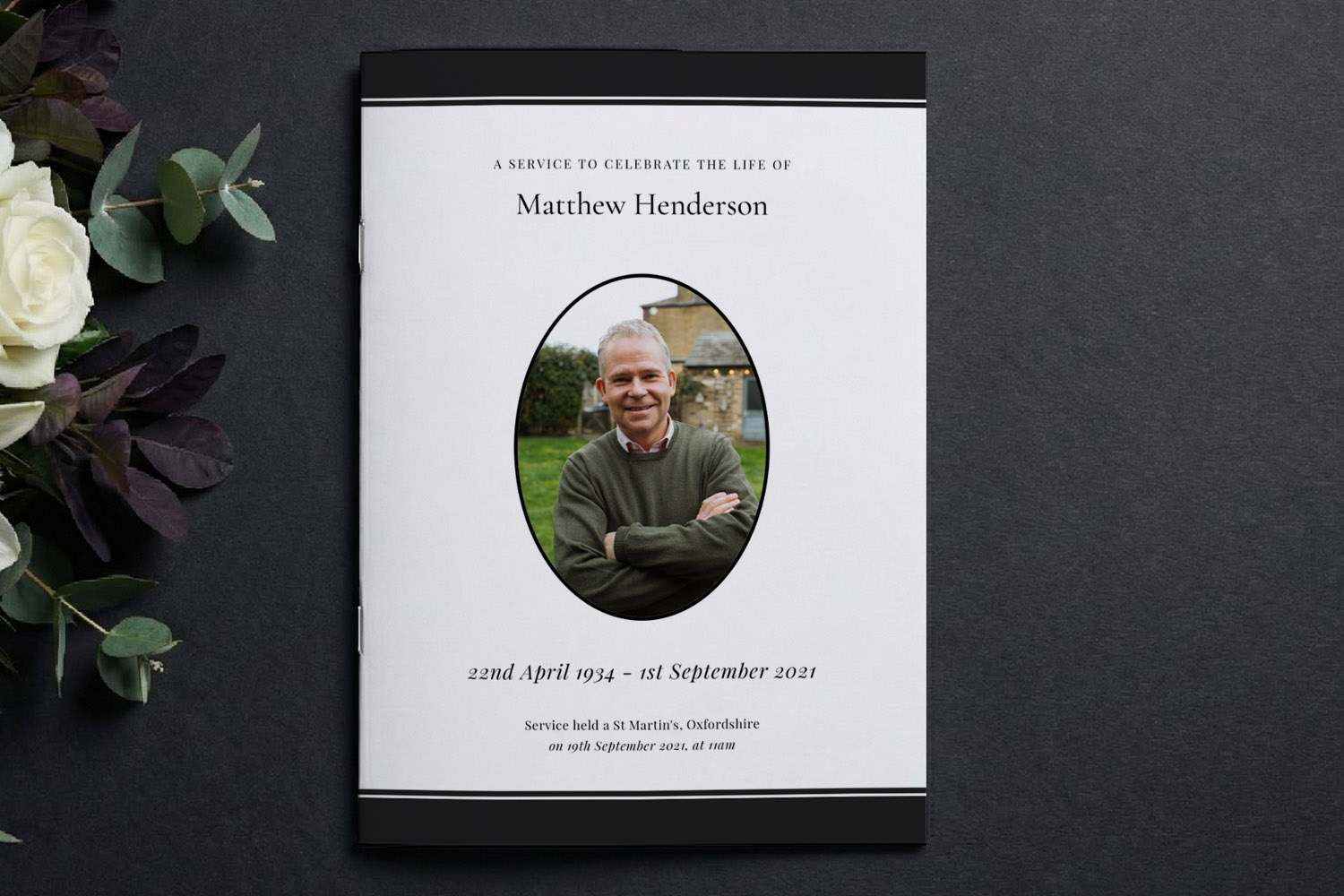 Funeral order of service booklet with classic white cover, black borders, and oval photo of the deceased on a dark background