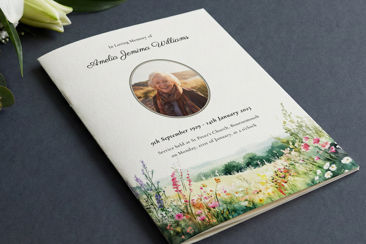 Funeral order of service booklet with floral border, personalised cover photo, and elegant script text on a dark background