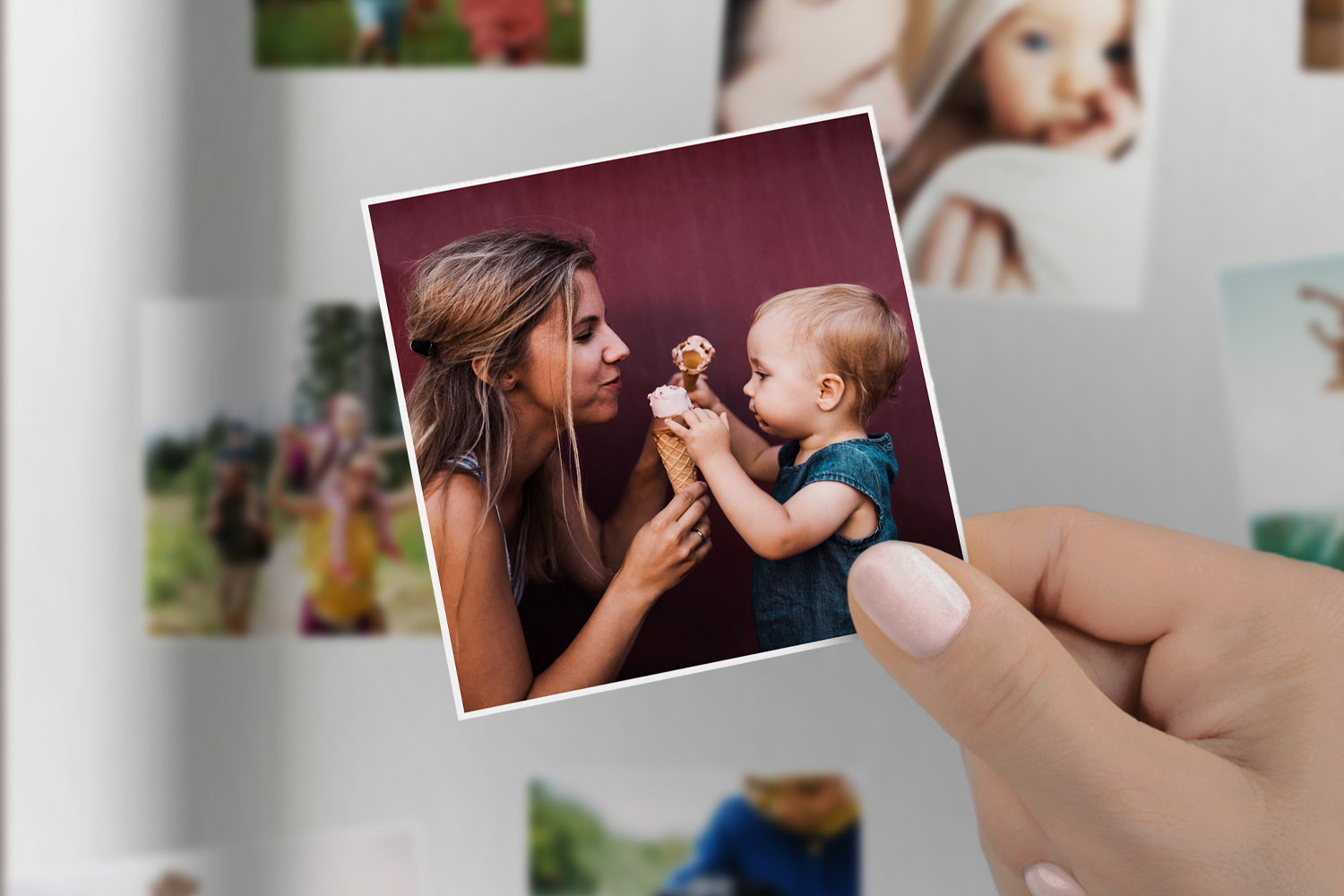 Personalised fridge magnets featuring a close-up photo of a woman and child sharing an ice cream, held by a hand