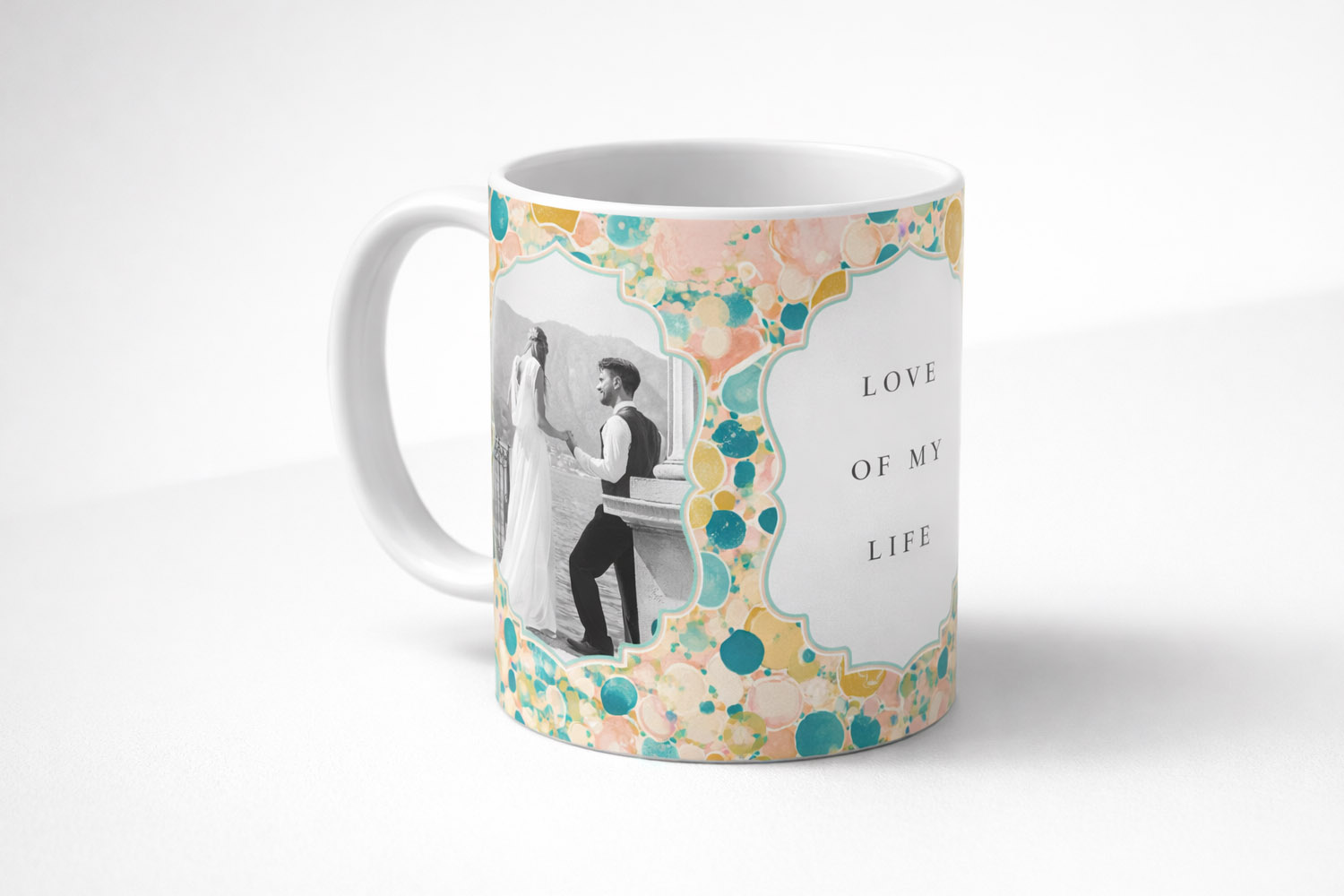 Personalised mug with a wedding photo and pastel bubble border, featuring the text love of my life on a white background.