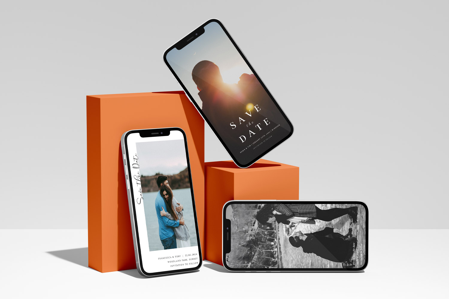 RSVP.studio weddings digital save the date invitations displayed on smartphones with modern orange geometric stands