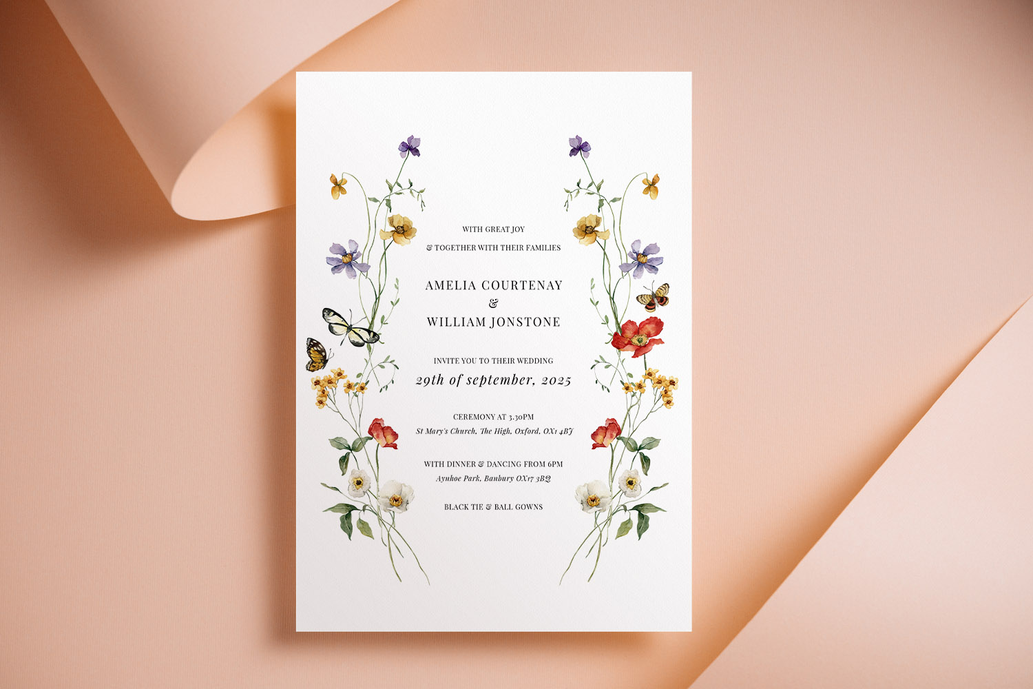 Wedding invitations with elegant floral border design, featuring colourful wildflowers and classic serif text on white card