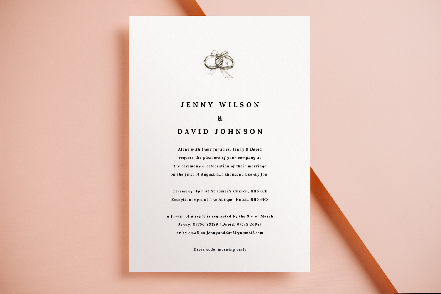 Wedding invitations featuring minimalist white card with black text and illustrated wedding rings, displayed on a peach