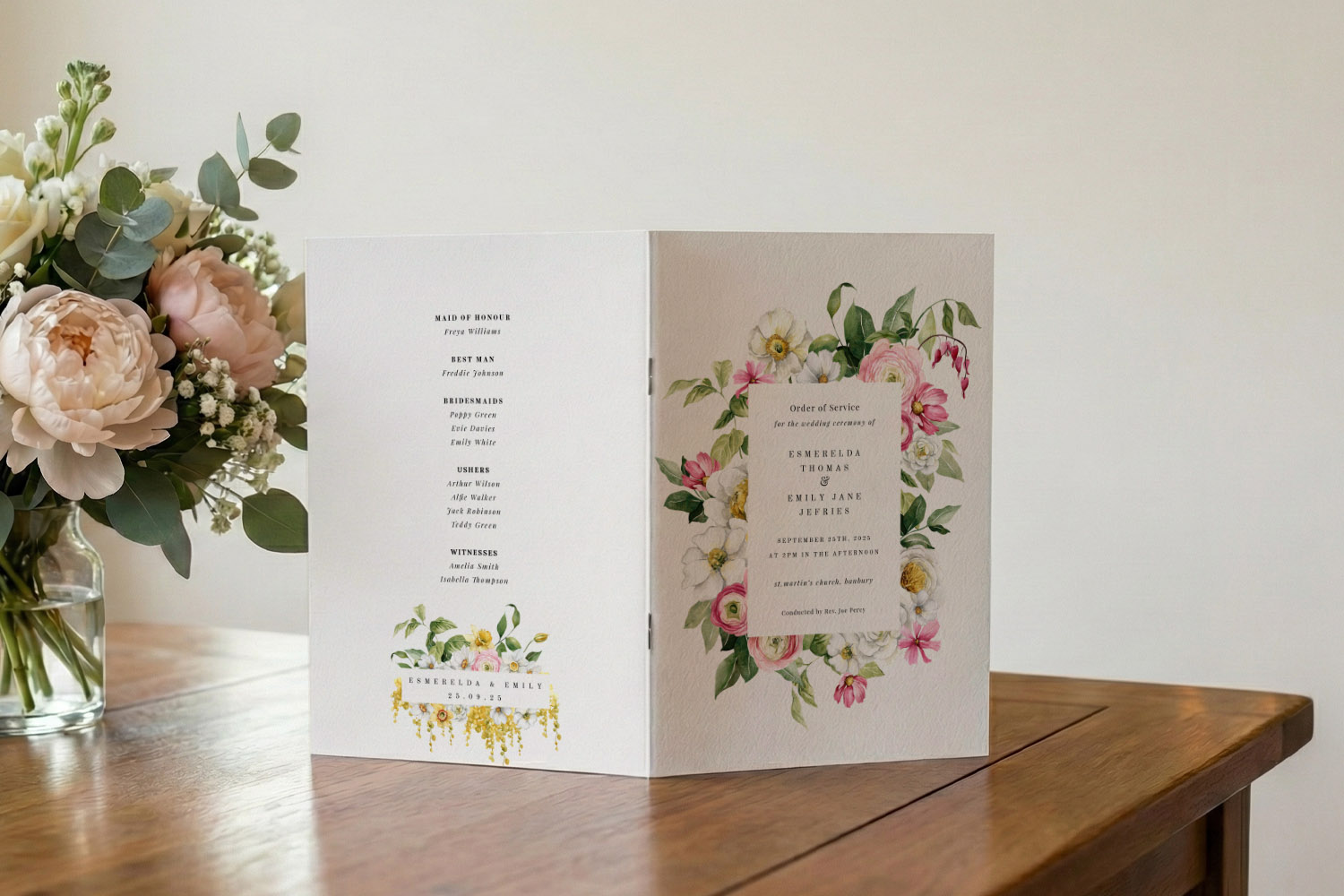 Wedding order of service booklet with floral cover design and printed ceremony details, displayed on a wooden table beside