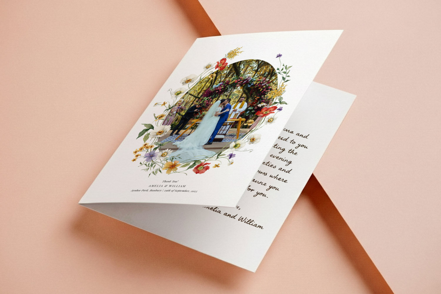 Wedding thank you cards with floral border and heart-shaped photo of a couple, displayed on a blush pink background,