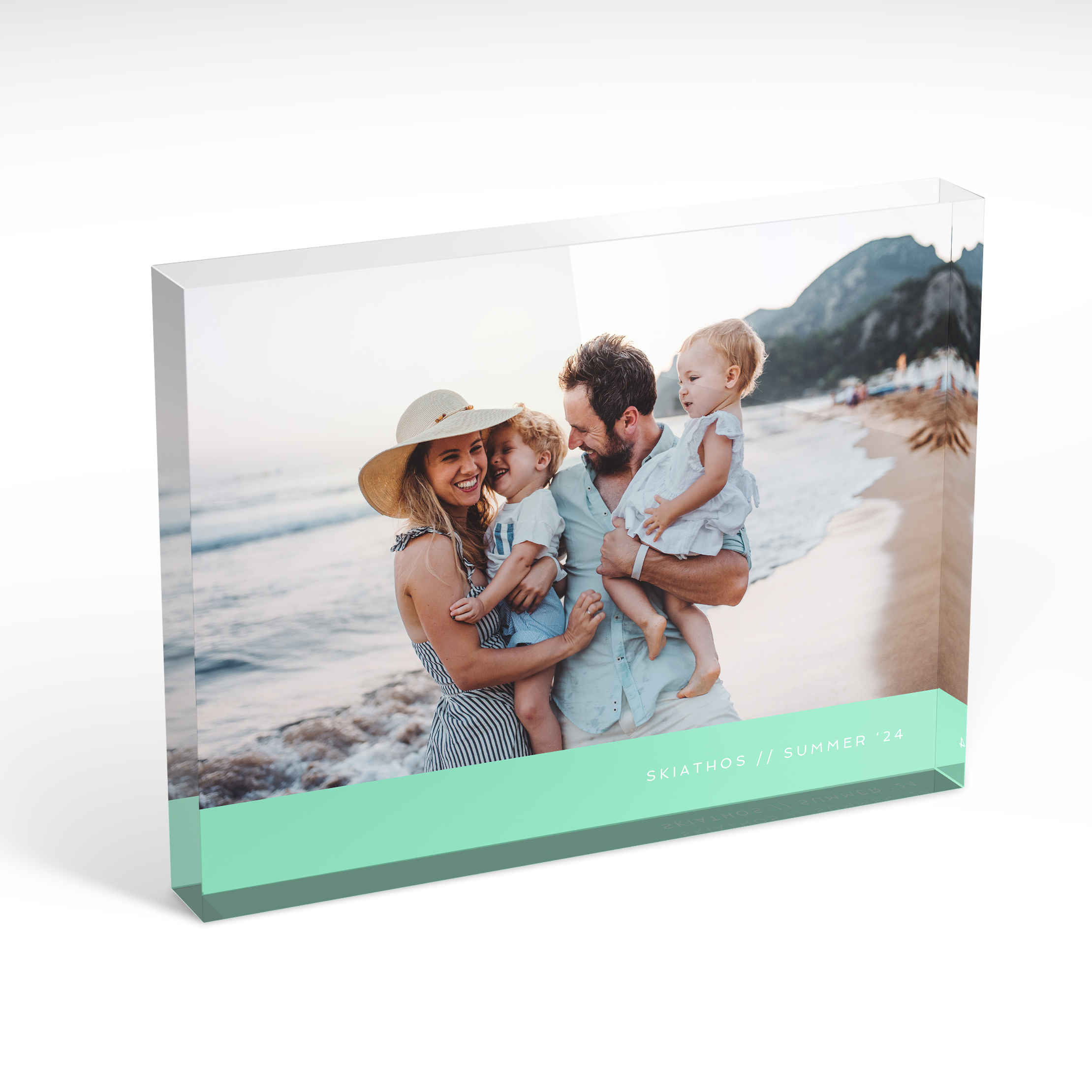 An angled side view of a landscape layout Acrylic Glass Photo Block with space for 1 photo. Thiis design is named "Mint Bottom". 