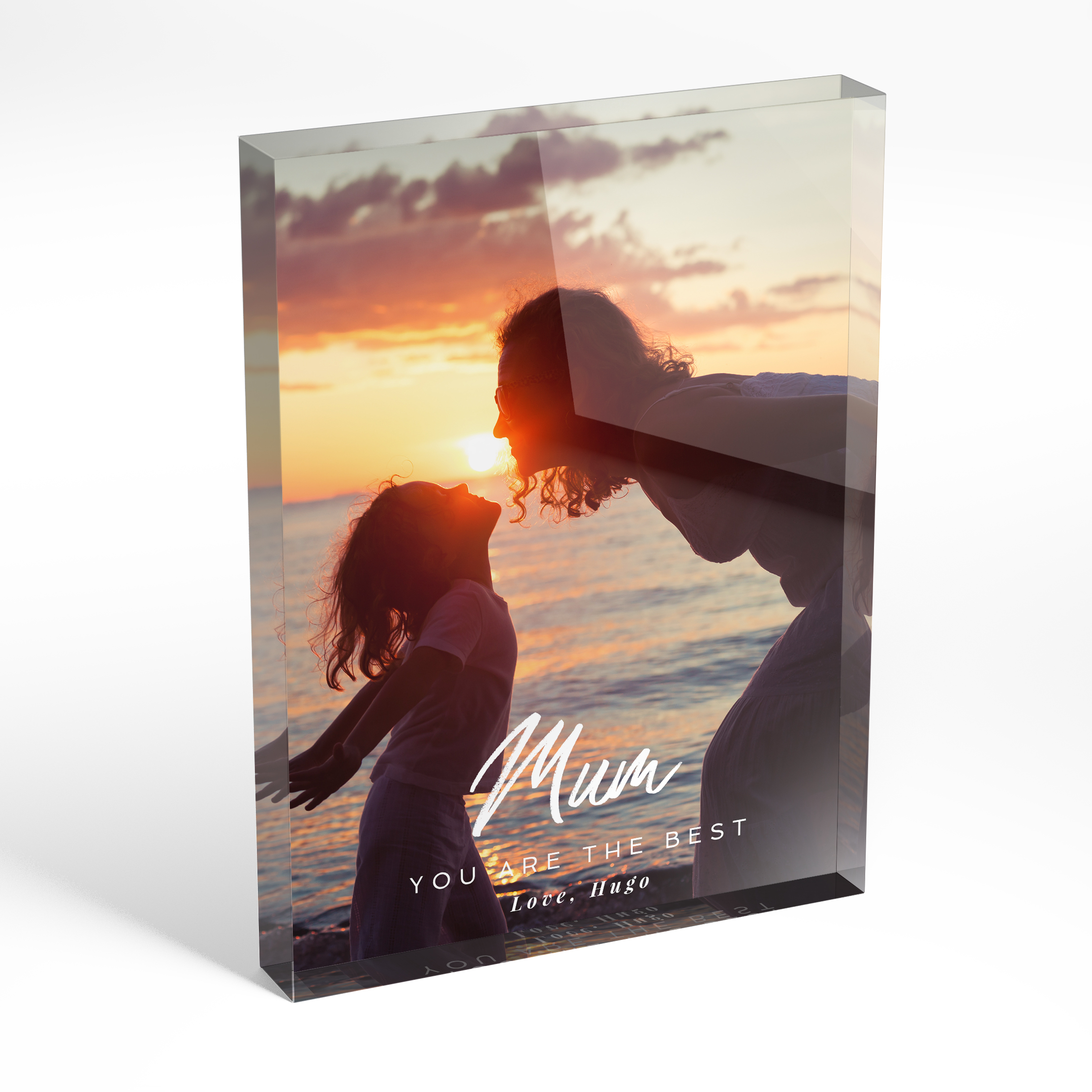 An angled side view of a portrait layout Acrylic Glass Photo Block with space for 1 photo. Thiis design is named "A Mother's Embrace". 