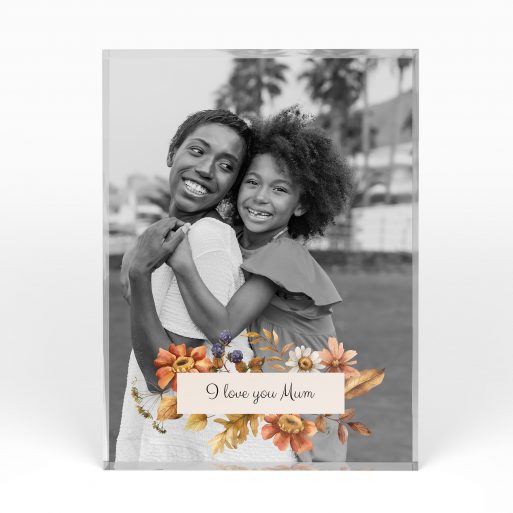 A front side view of a portrait layout Acrylic Glass Photo Block with space for 1 photo. Thiis design is named "Blooming Motherhood". 