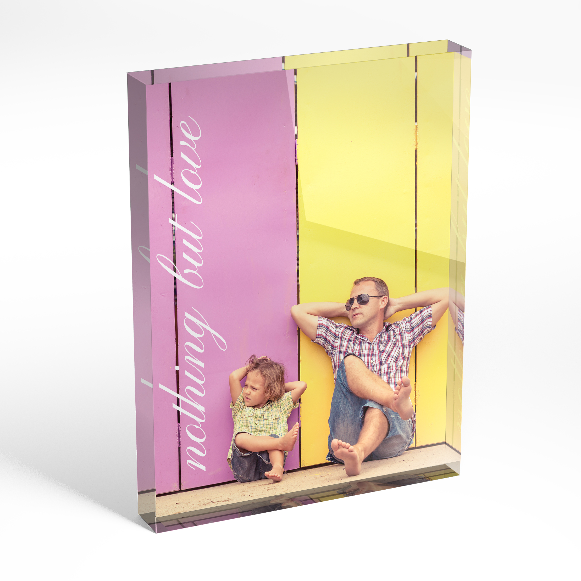 An angled side view of a portrait layout Acrylic Glass Photo Block with space for 1 photo. Thiis design is named "Nothing but Love". 