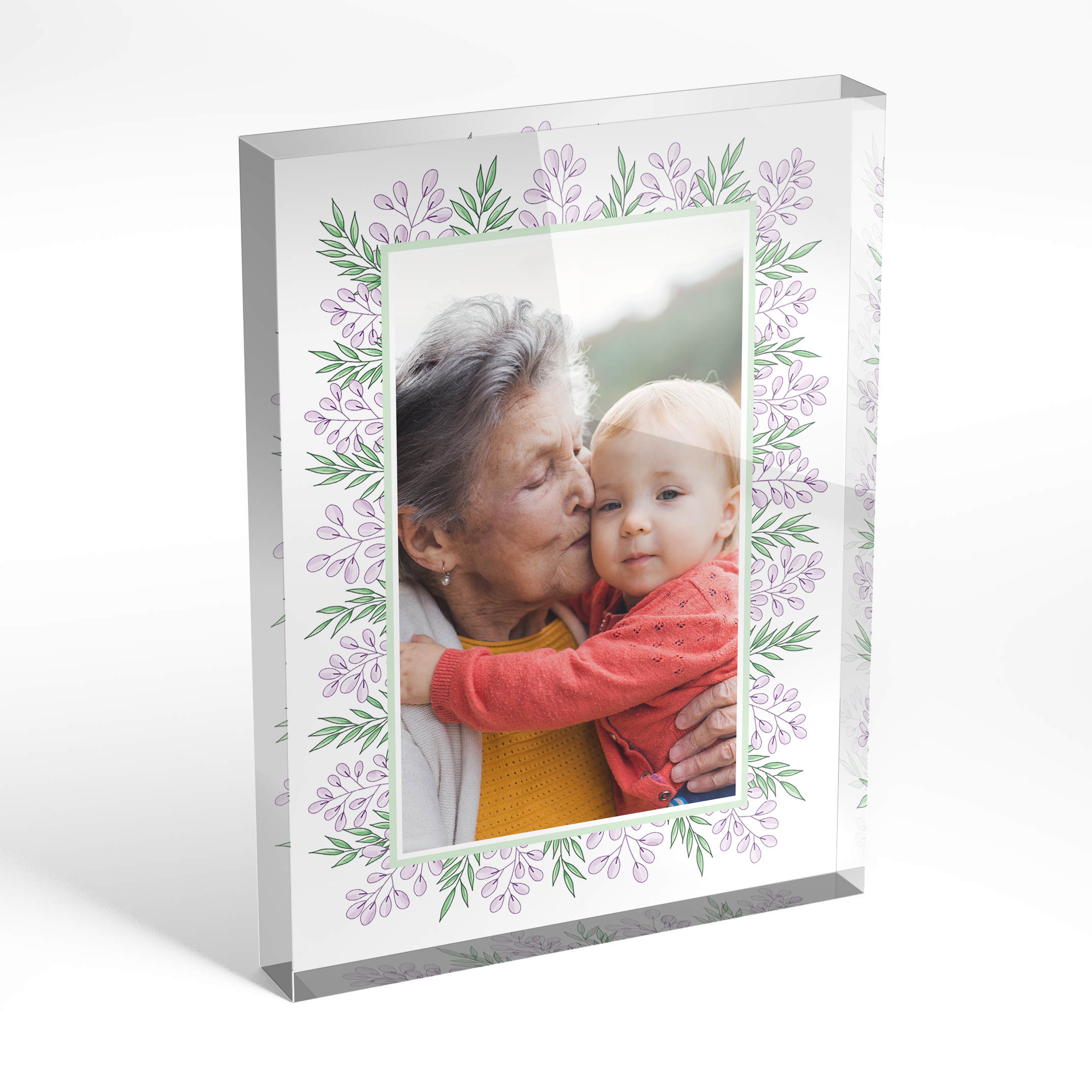 An angled side view of a portrait layout Acrylic Photo Block with space for 1 photo. Thiis design is named "Floral Memories". 