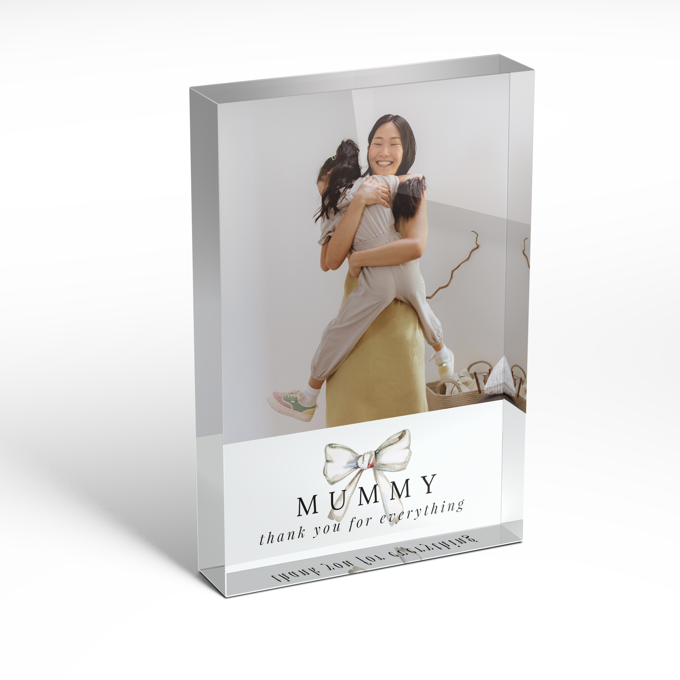 A front side view of a portrait layout Online acrylic photo blocks with space for 1 photo. Thiis design is named 'Tied with a bow'. 