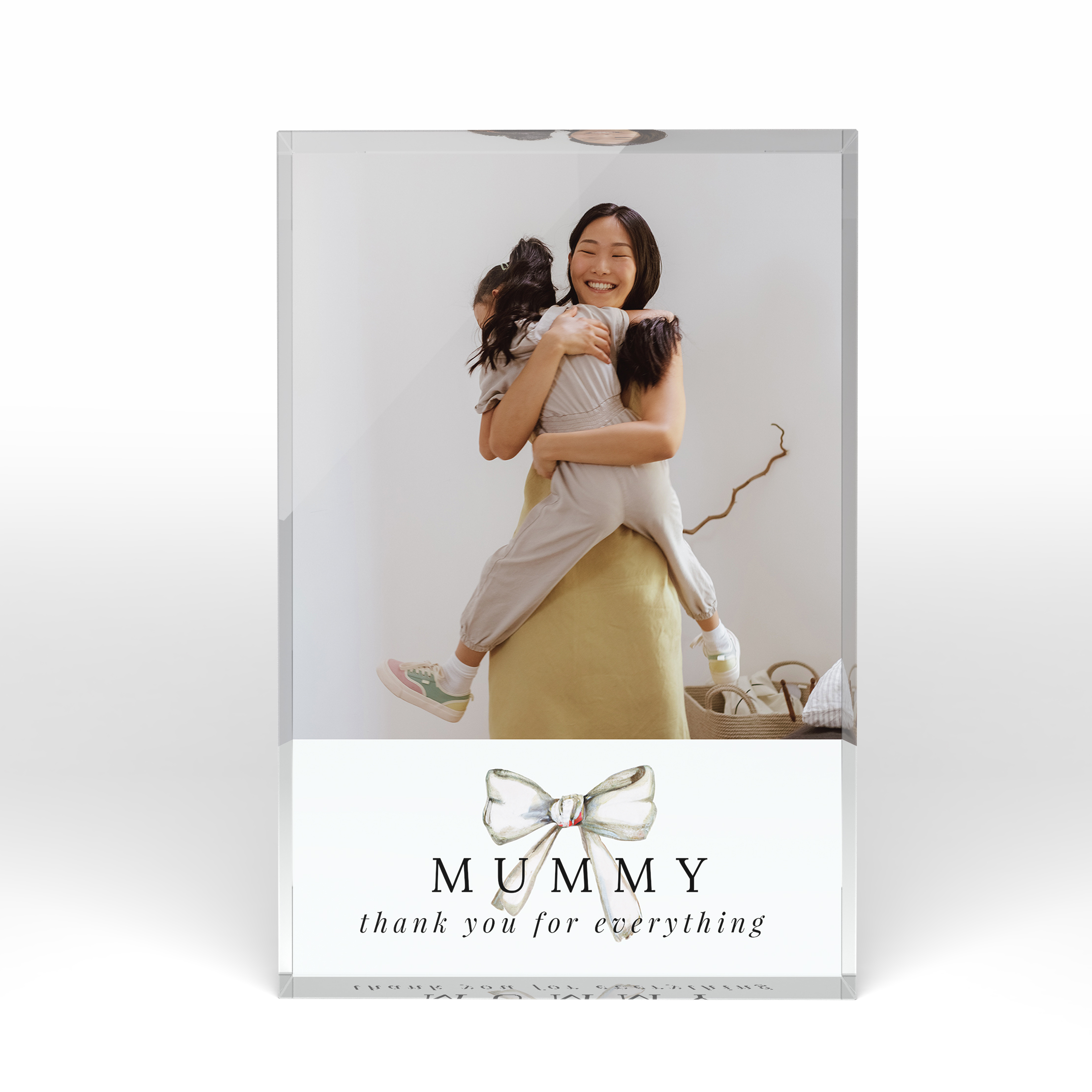 A front side view of a portrait layout Online acrylic photo blocks with space for 1 photo. Thiis design is named "Tied with a bow". 