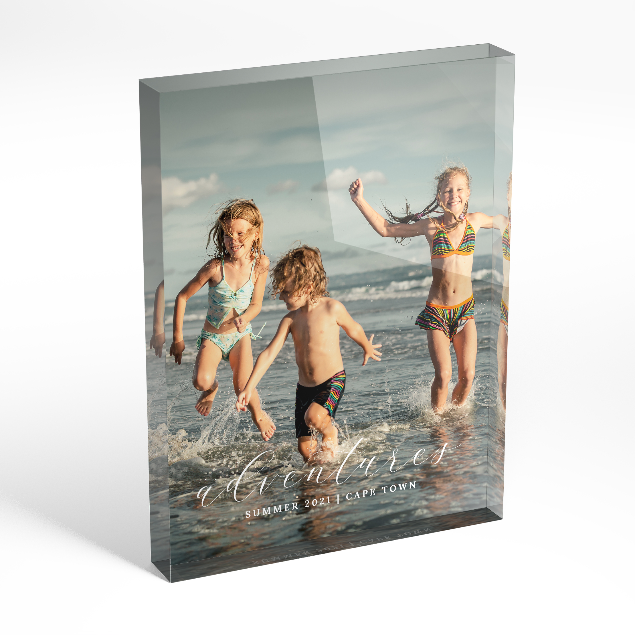 A front side view of a portrait layout Acrylic Glass Photo Block with space for 1 photo. Thiis design is named 'Adventures'. 