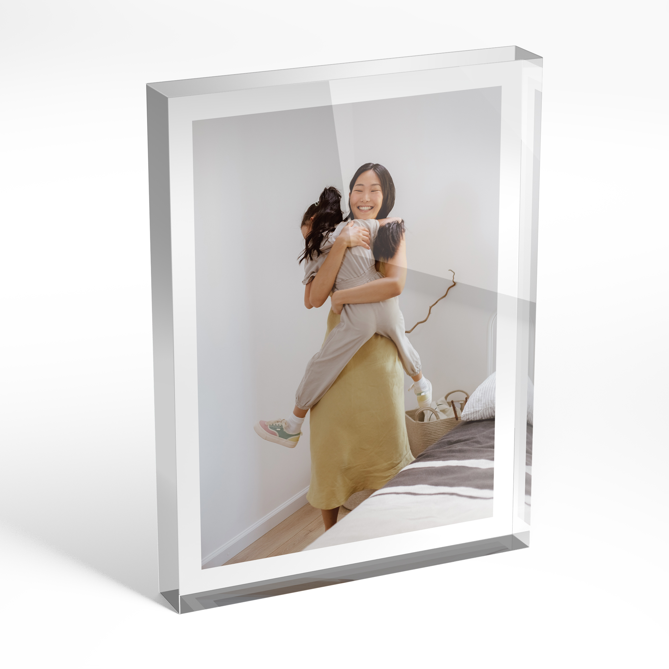 An angled side view of a portrait layout Perspex Photo Blocks with space for 1 photo. Thiis design is named "Medium White Frame". 