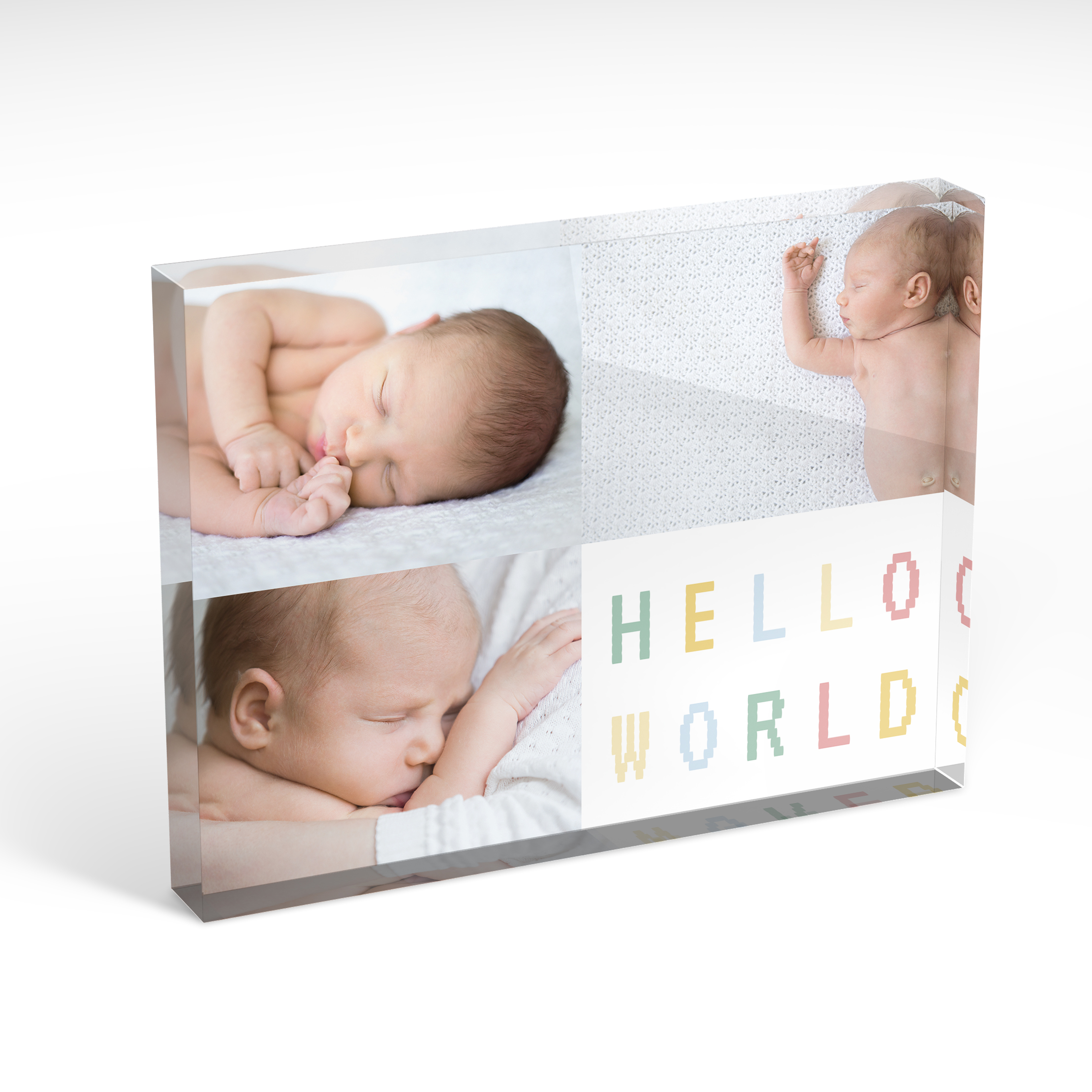 An angled side view of a landscape layout Acrylic Photo Block with space for 3 photos. Thiis design is named "Hello World Corner". 