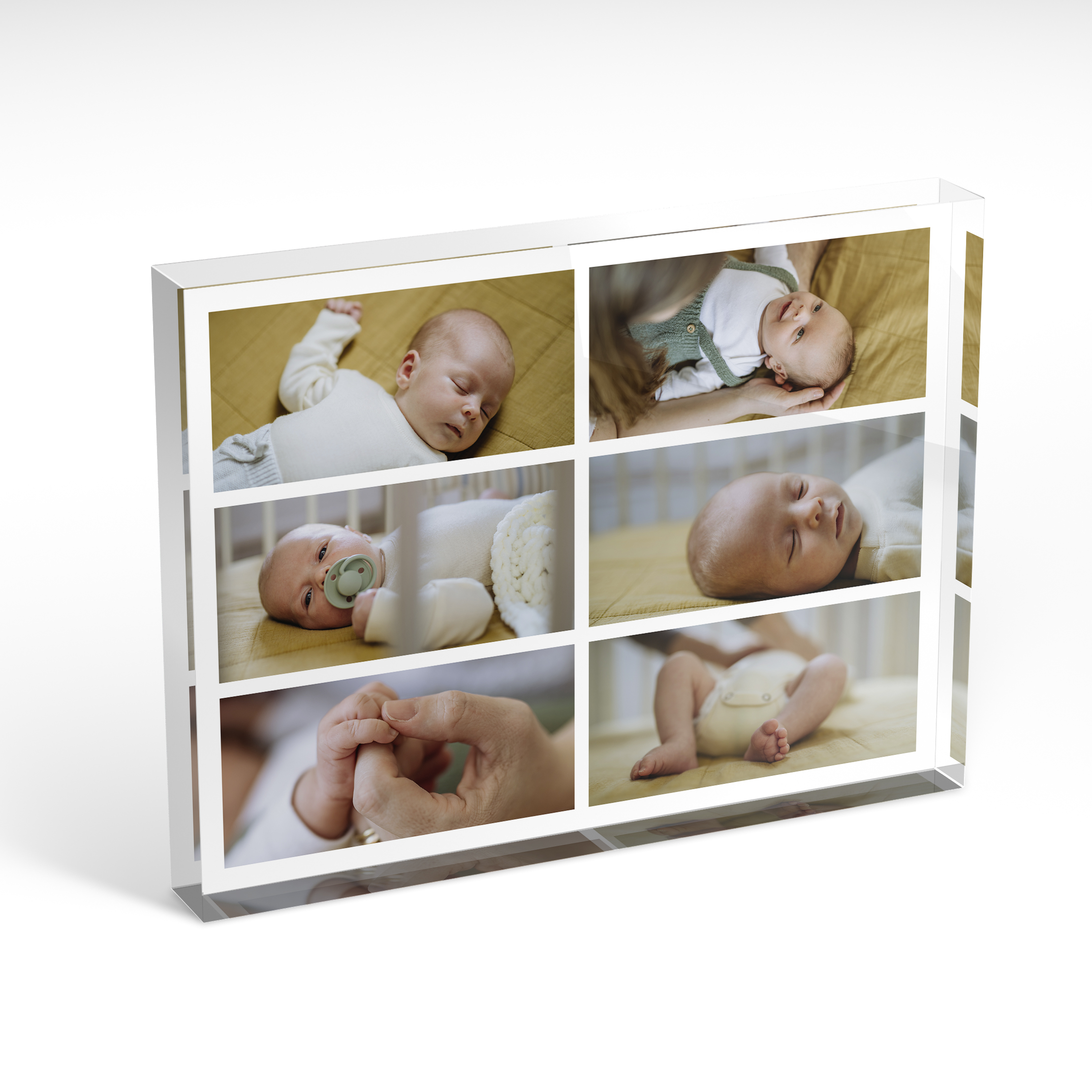 A front side view of a landscape layout Acrylic Glass Photo Block with space for 6 photos. Thiis design is named 'Children's Mosaic'. 