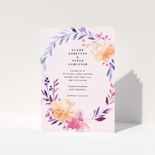 Above and Below Wedding Order of Service booklet with elegant floral illustrations cascading from top and blooming up from bottom in pastel blues, pinks, and oranges This is a view of the front