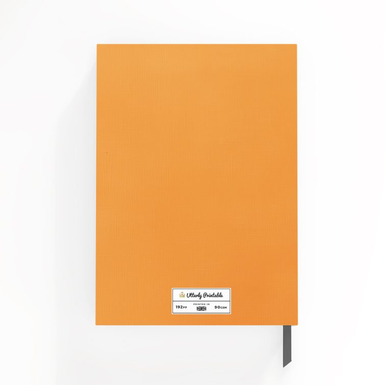 Orange floral-themed portrait notebook with one black and white photo on the cover design.