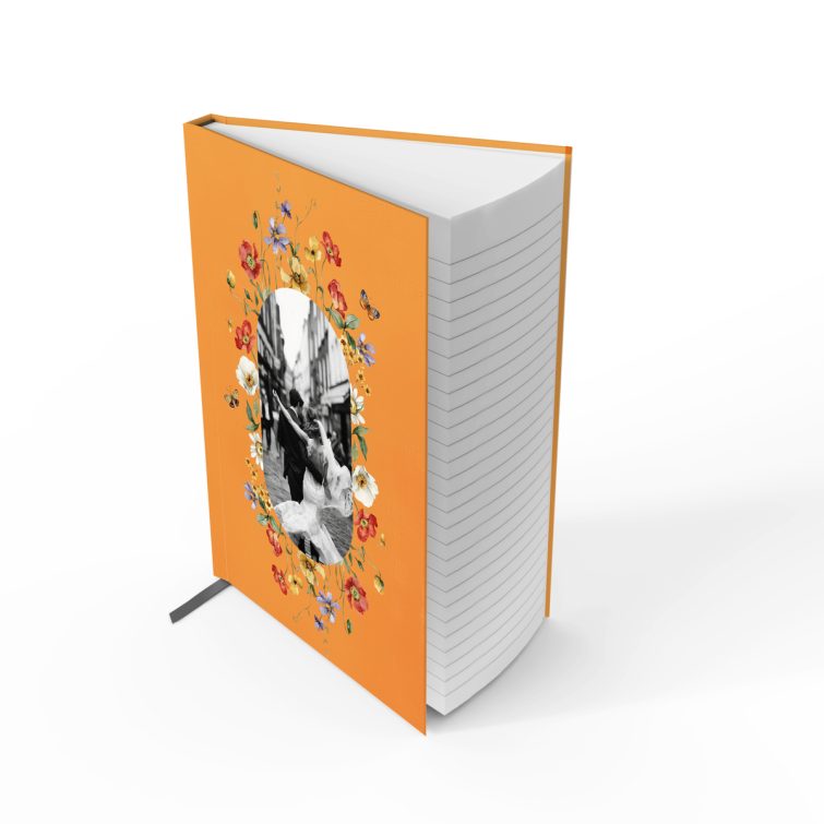 Orange floral-themed portrait notebook with one black and white photo on the cover design.