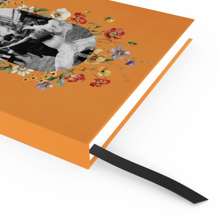 Orange floral-themed portrait notebook with one black and white photo on the cover design.