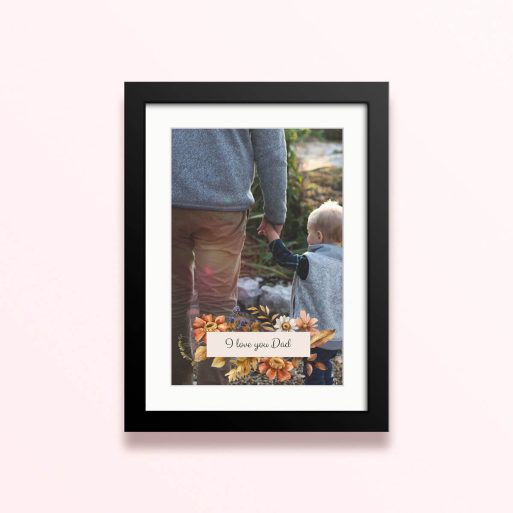 Framed and mounted photo print with decorative floral design and one photo.