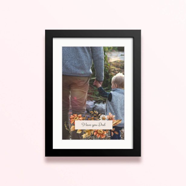Framed and mounted photo print with decorative floral design and one photo.