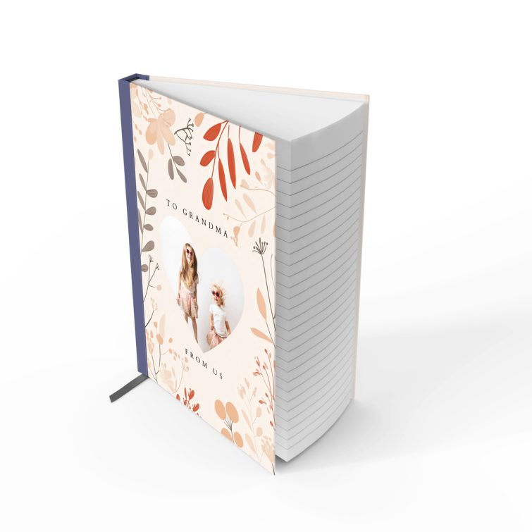 Floral personalised notebook cover design with heart-shaped photo cutout, featuring two photos, by Utterly Printable.