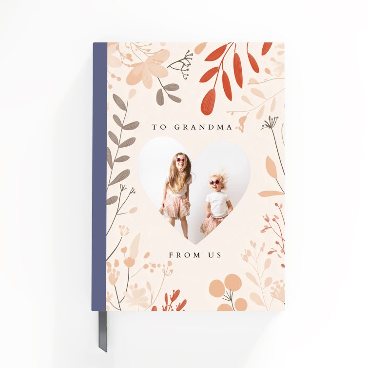 Floral personalised notebook cover design with heart-shaped photo cutout, featuring two photos, by Utterly Printable.