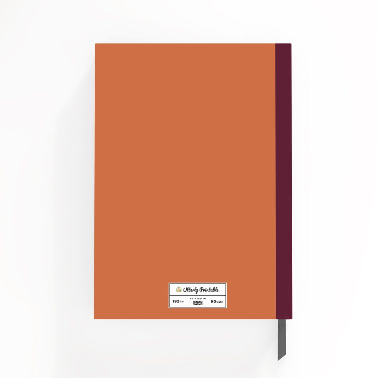 Customisable portrait notebook design with orange cover and burgundy spine, featuring one photo placeholder.