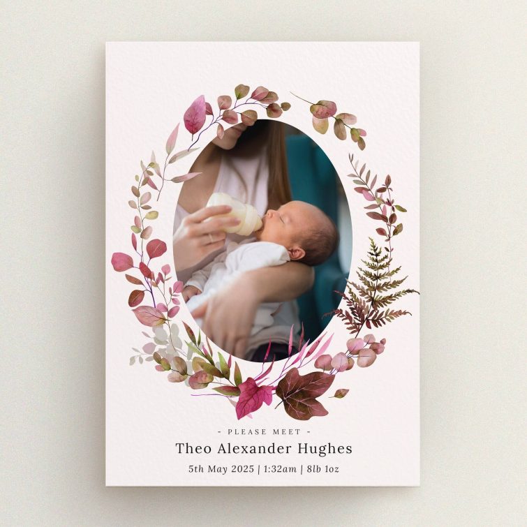 Floral birth announcement card design with one photo of a baby being bottle-fed.