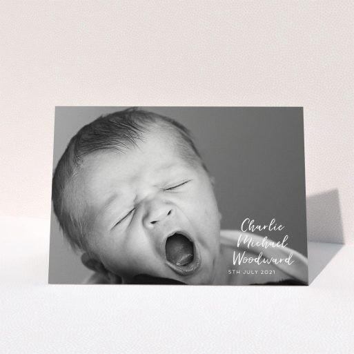 A baby card design called "1 Photo Full". It is an A5 card in a landscape orientation. It is a photographic baby card with room for 1 photo. "1 Photo Full" is available as a folded card, with mainly white colouring.