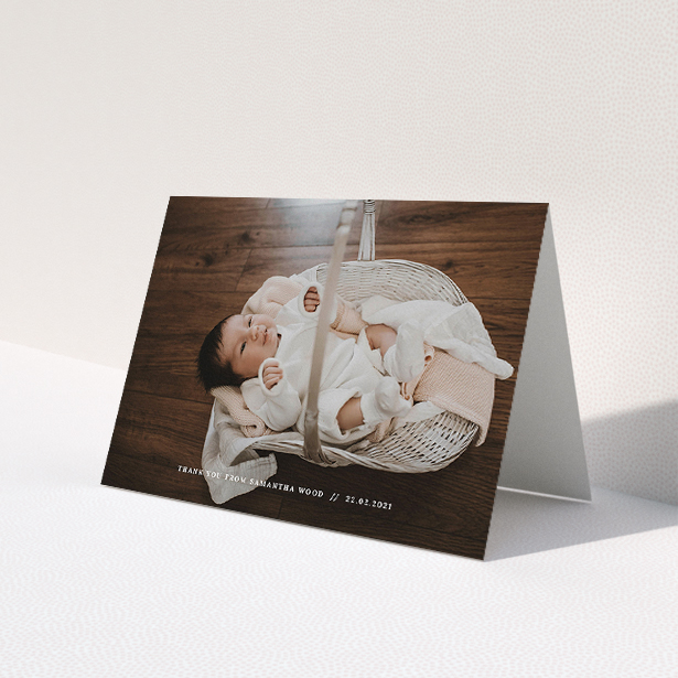 A baby card template titled "Along the bottom". It is an A5 card in a landscape orientation. It is a photographic baby card with room for 1 photo. "Along the bottom" is available as a folded card, with mainly white colouring.
