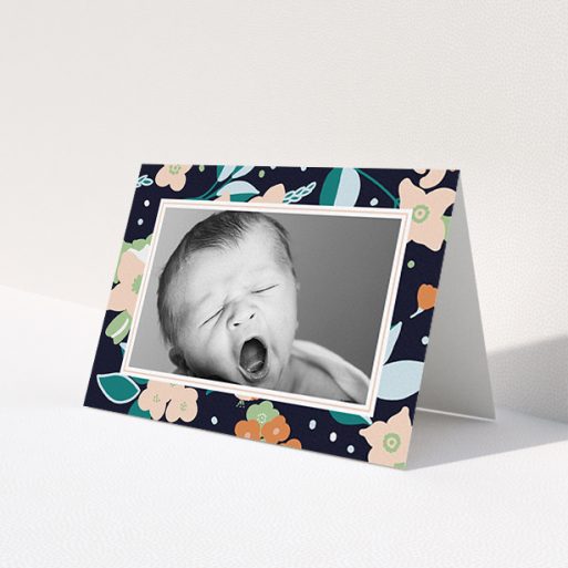 A baby card design titled 'Bedtime Garden'. It is an A6 card in a landscape orientation. It is a photographic baby card with room for 1 photo. 'Bedtime Garden' is available as a folded card, with tones of navy blue, pink and orange.