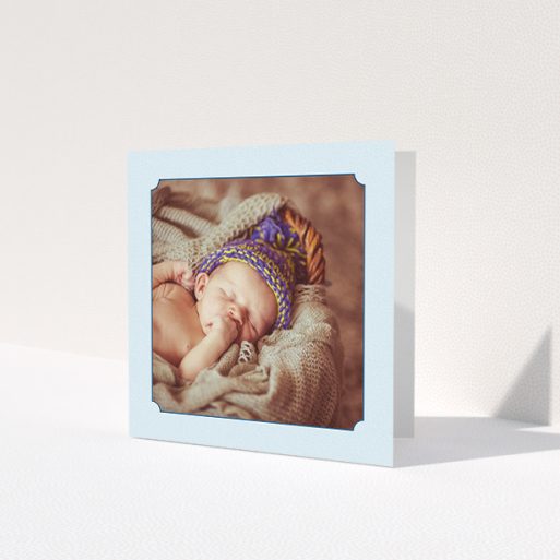 A baby card named 'Classic Frame'. It is a square (148mm x 148mm) card in a square orientation. It is a photographic baby card with room for 1 photo. 'Classic Frame' is available as a folded card, with mainly blue colouring.