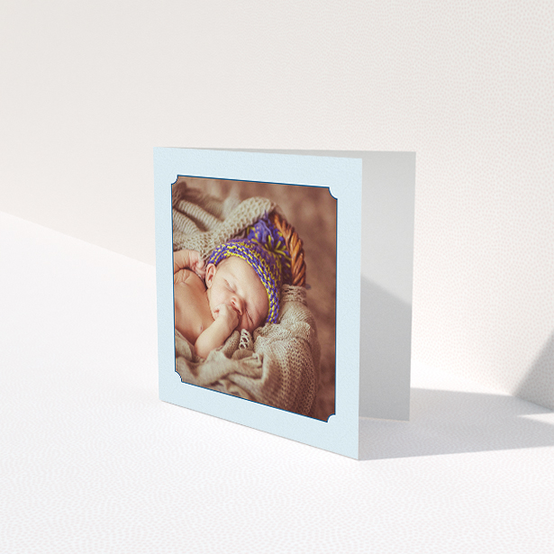 A baby card named "Classic Frame". It is a square (148mm x 148mm) card in a square orientation. It is a photographic baby card with room for 1 photo. "Classic Frame" is available as a folded card, with mainly blue colouring.