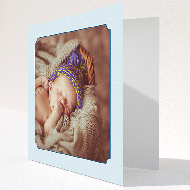 A baby card named "Classic Frame". It is a square (148mm x 148mm) card in a square orientation. It is a photographic baby card with room for 1 photo. "Classic Frame" is available as a folded card, with mainly blue colouring.