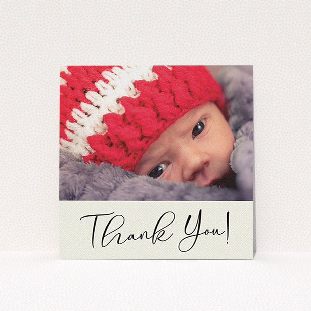 A baby card named "Cursive Thanks". It is a square (148mm x 148mm) card in a square orientation. It is a photographic baby card with room for 1 photo. "Cursive Thanks" is available as a flat card, with mainly cream colouring.