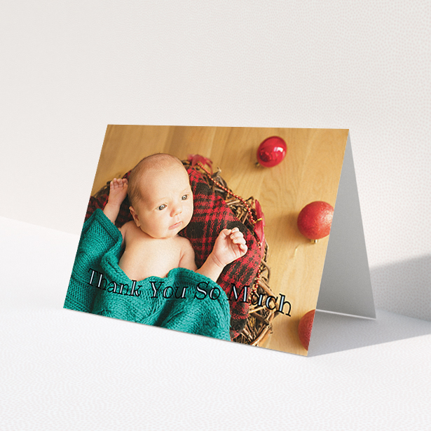 A baby card design named "Curvy Thanks". It is an A6 card in a landscape orientation. It is a photographic baby card with room for 1 photo. "Curvy Thanks" is available as a folded card, with mainly blue colouring.