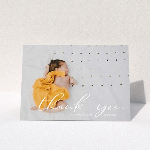 A baby card called "Handwritten Thanks". It is an A5 card in a landscape orientation. It is a photographic baby card with room for 1 photo. "Handwritten Thanks" is available as a folded card, with mainly white colouring.