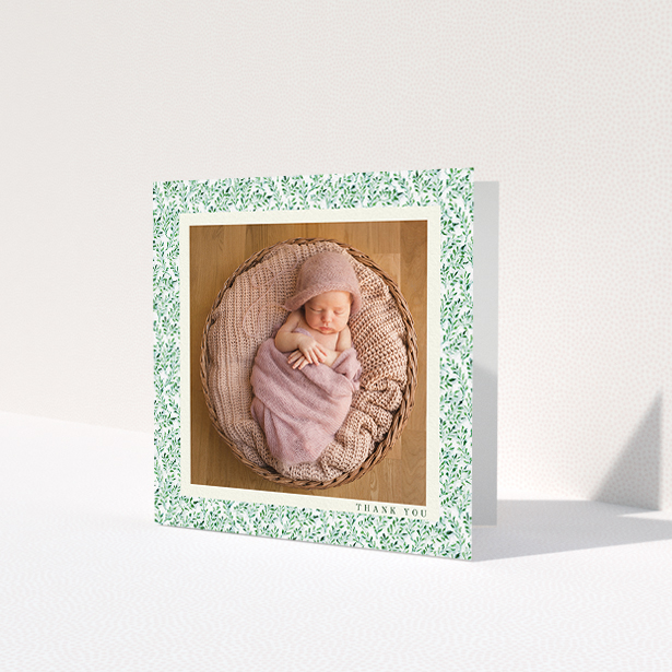 A baby card design titled "Hedgerow Frame". It is a square (148mm x 148mm) card in a square orientation. It is a photographic baby card with room for 1 photo. "Hedgerow Frame" is available as a folded card, with tones of green and white.