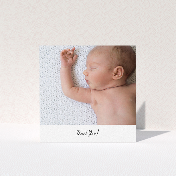 A baby card called "Mr & Mrs Footer". It is a square (148mm x 148mm) card in a square orientation. It is a photographic baby card with room for 1 photo. "Mr & Mrs Footer" is available as a folded card, with mainly white colouring.