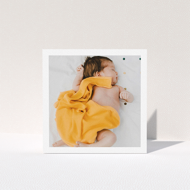 A baby card named "One Photo Thanks". It is a square (148mm x 148mm) card in a square orientation. It is a photographic baby card with room for 1 photo. "One Photo Thanks" is available as a folded card, with mainly white colouring.