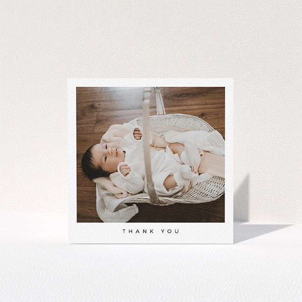 A baby card design named "Simple". It is a square (148mm x 148mm) card in a square orientation. It is a photographic baby card with room for 1 photo. "Simple" is available as a folded card, with mainly white colouring.