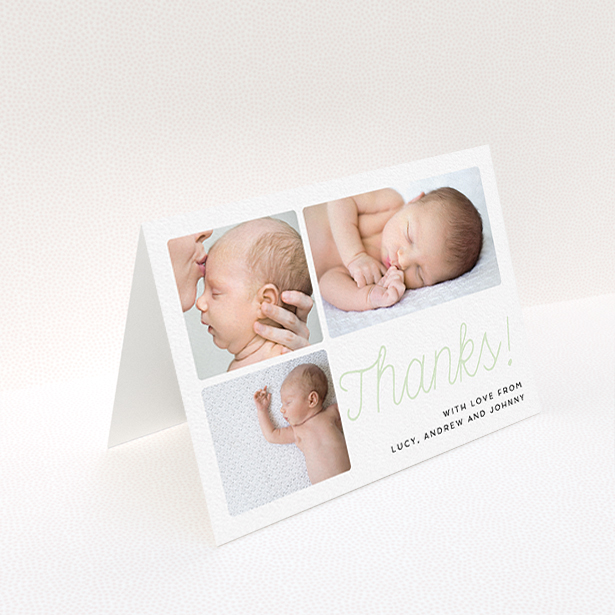 A baby card design named "Thank You Cursive". It is an A6 card in a landscape orientation. It is a photographic baby card with room for 3 photos. "Thank You Cursive" is available as a folded card, with tones of white and green.